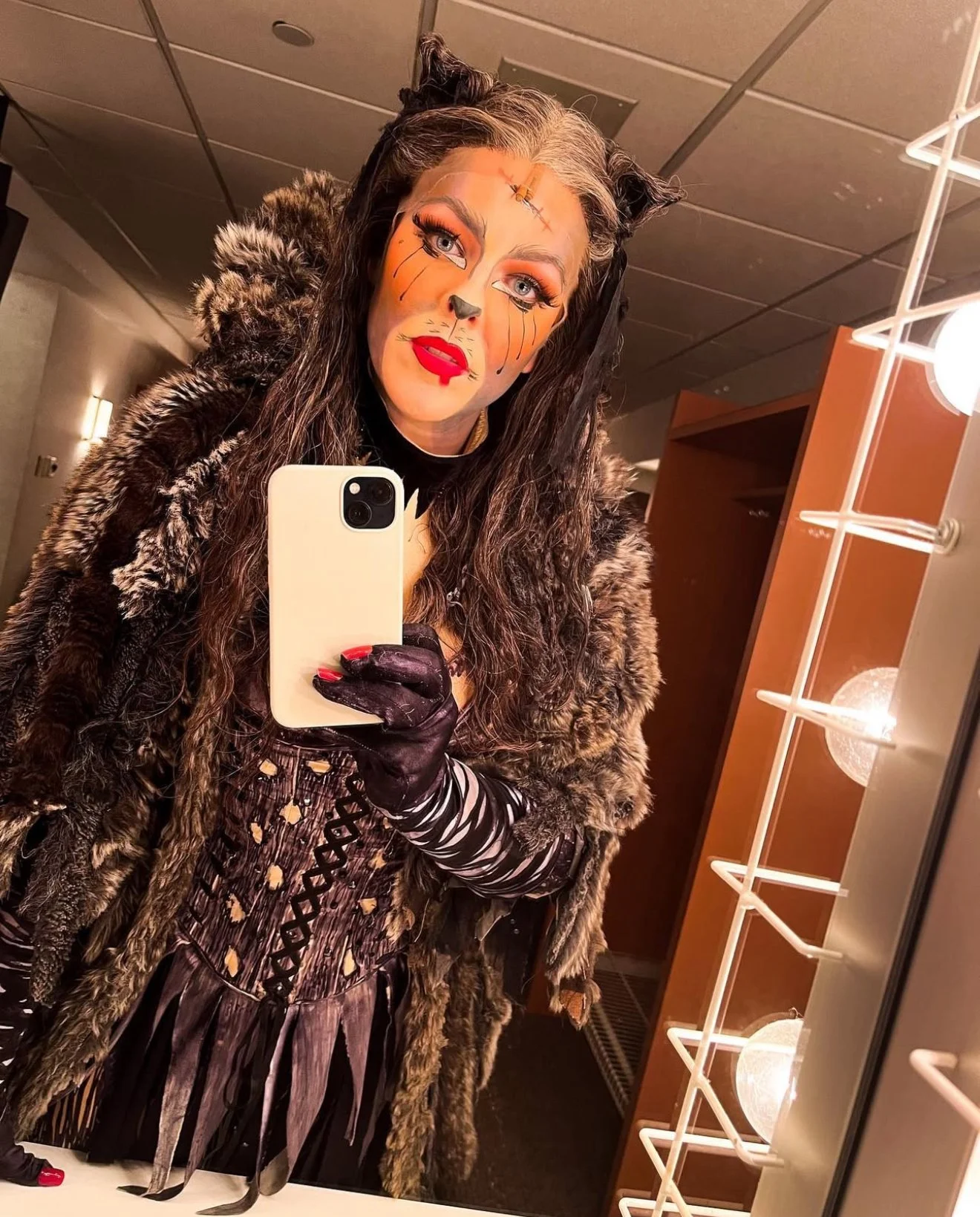 Actor dressed as Grizabella in CATS the Musical on the North American Tour posing for a selfie.