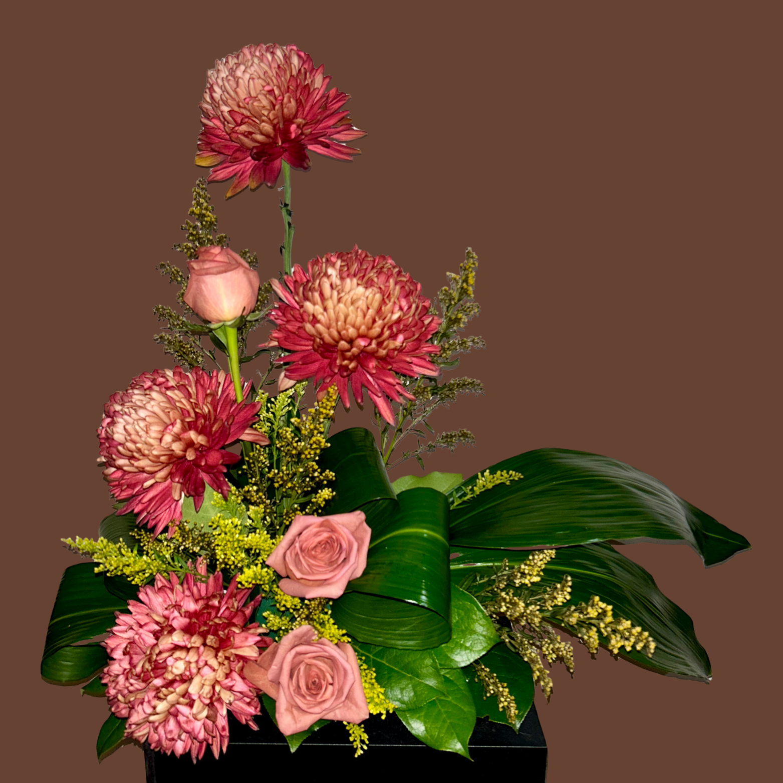 Asymmetrical flower arrangement  with aspidistra leaves