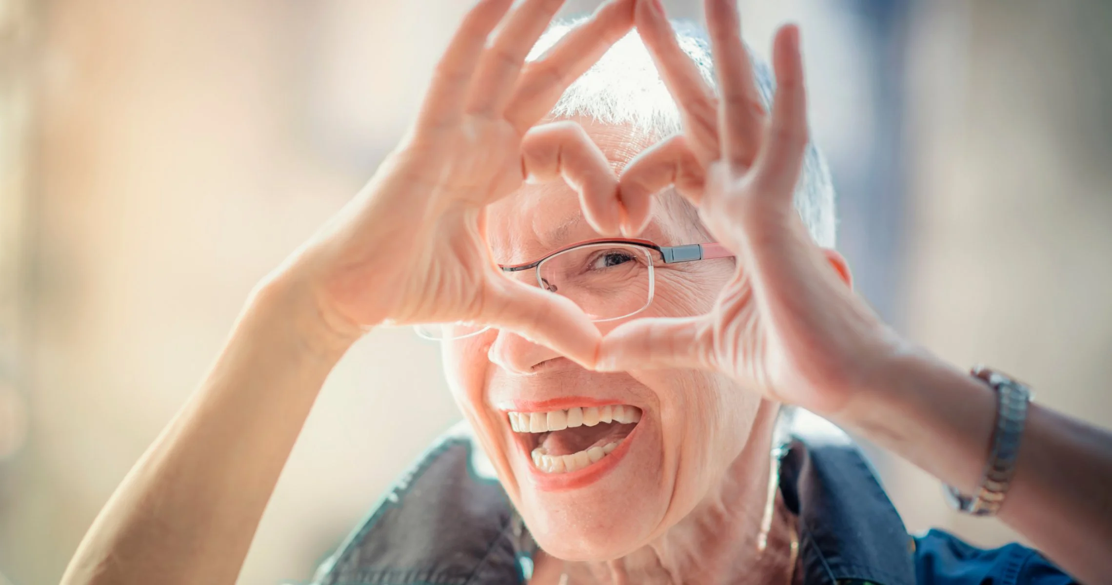 Happy older woman, reminding us that self-compassion can make all the difference