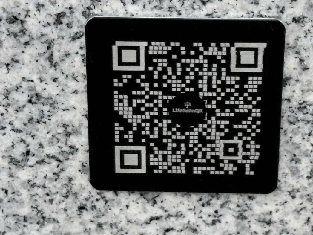 Laser engraved QR code memorial plaque made from anodized aluminum for long term outdoor durability
