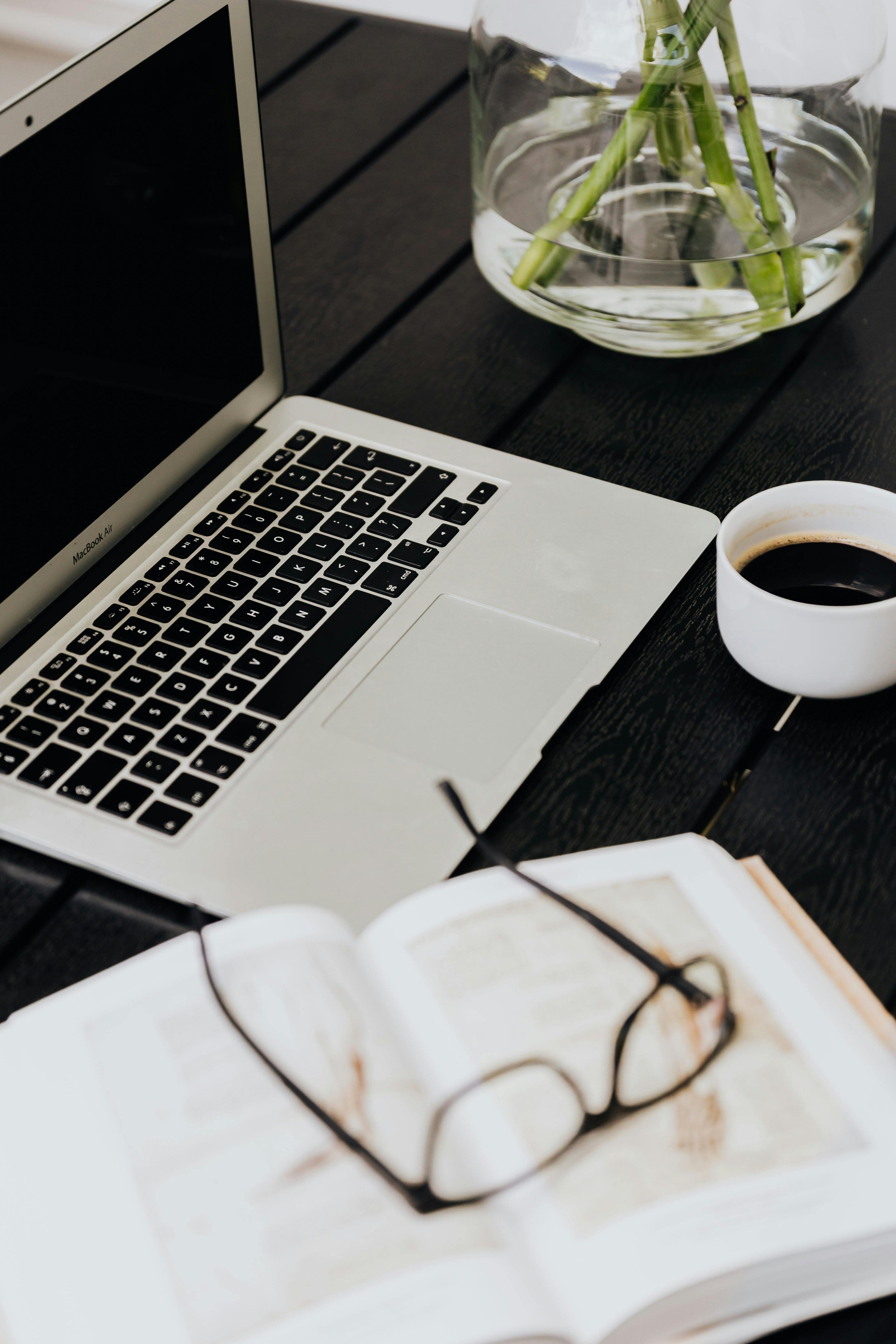 Laptop and notebook representing virtual therapy sessions and remote counseling