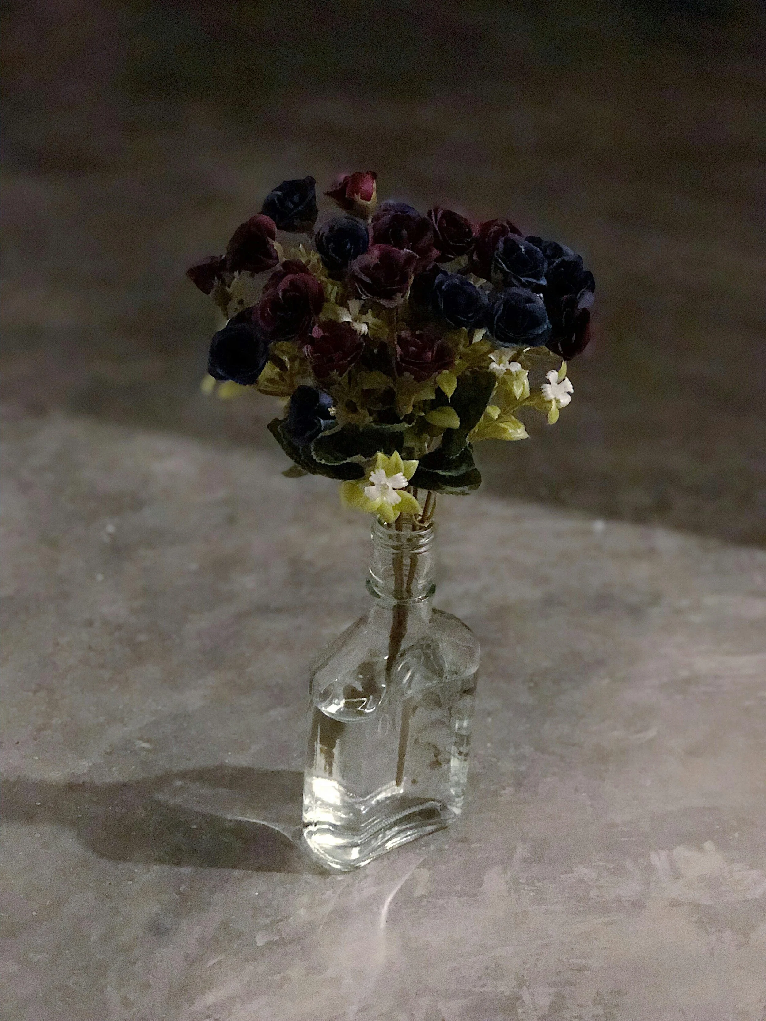 moody glass vase with dark florals