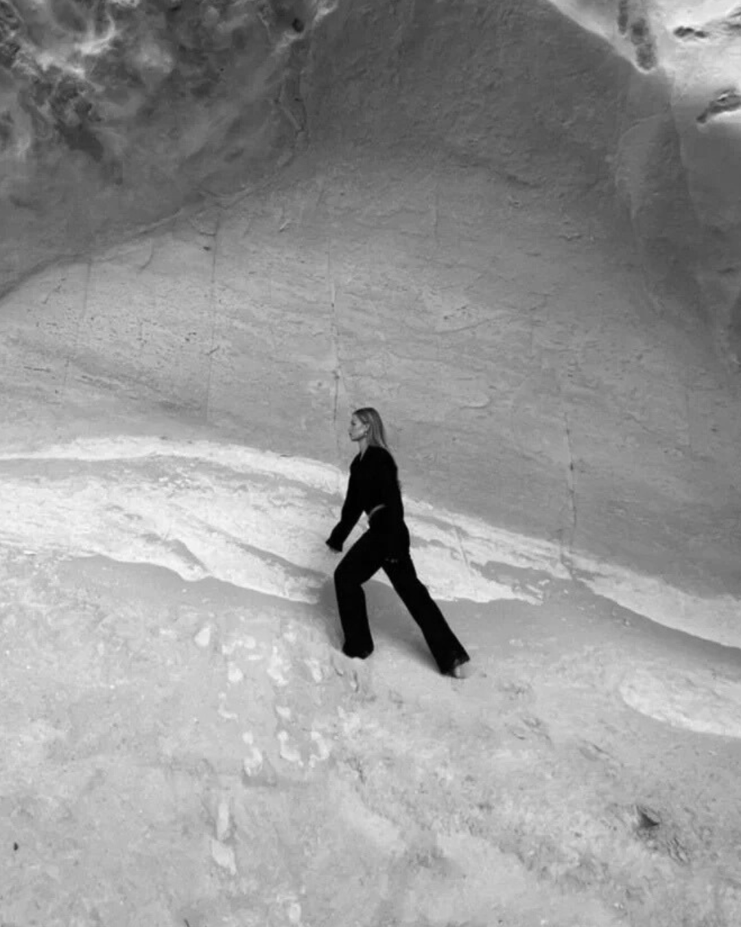 Woman walking on beach representing clarity and forward movement in therapy