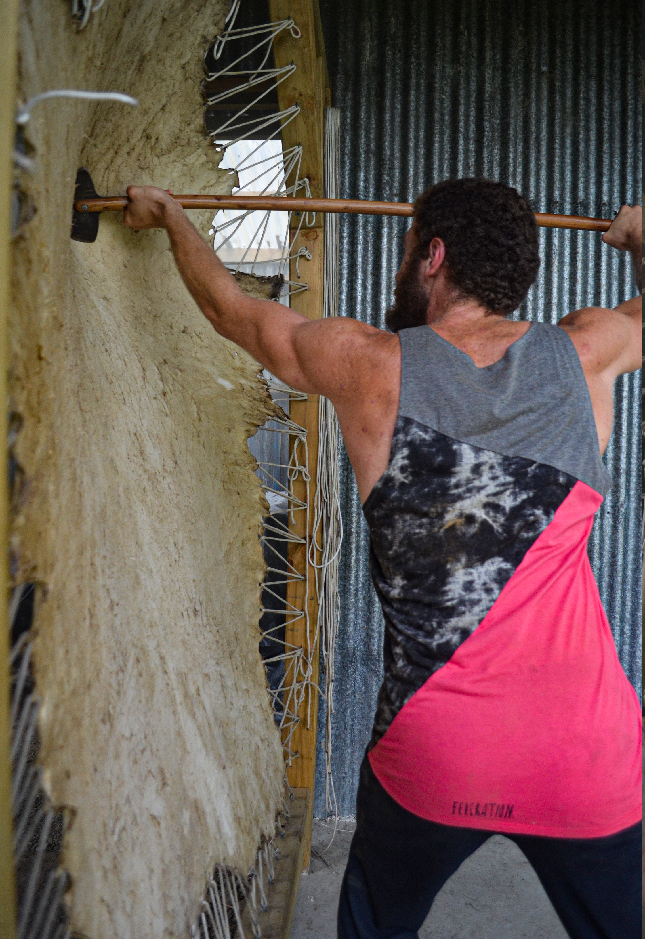 This is me softening a hide or "staking" a hide on the frame.