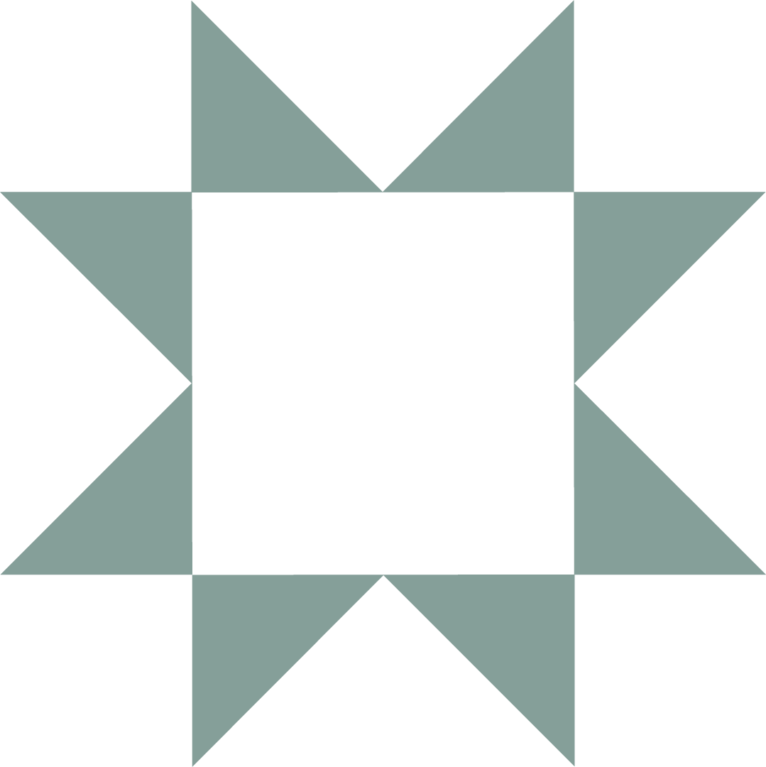 A geometric quilt pattern with a central black square, surrounded by alternating light teal triangles and squares forming a star-like shape.