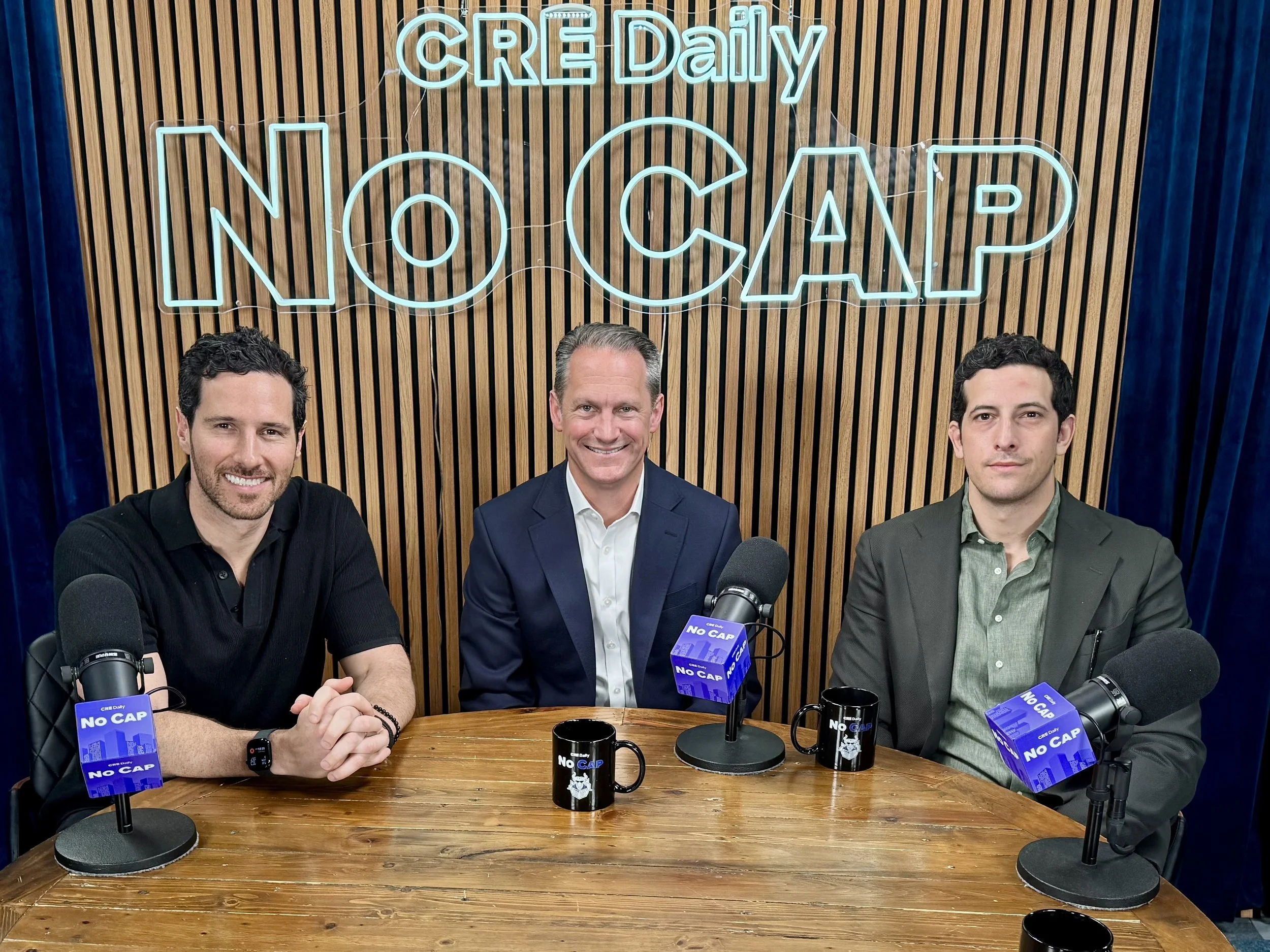 Jack Stone and Alex Gornik hosting a No Cap Podcast interview with a featured guest, discussing commercial real estate and capital markets