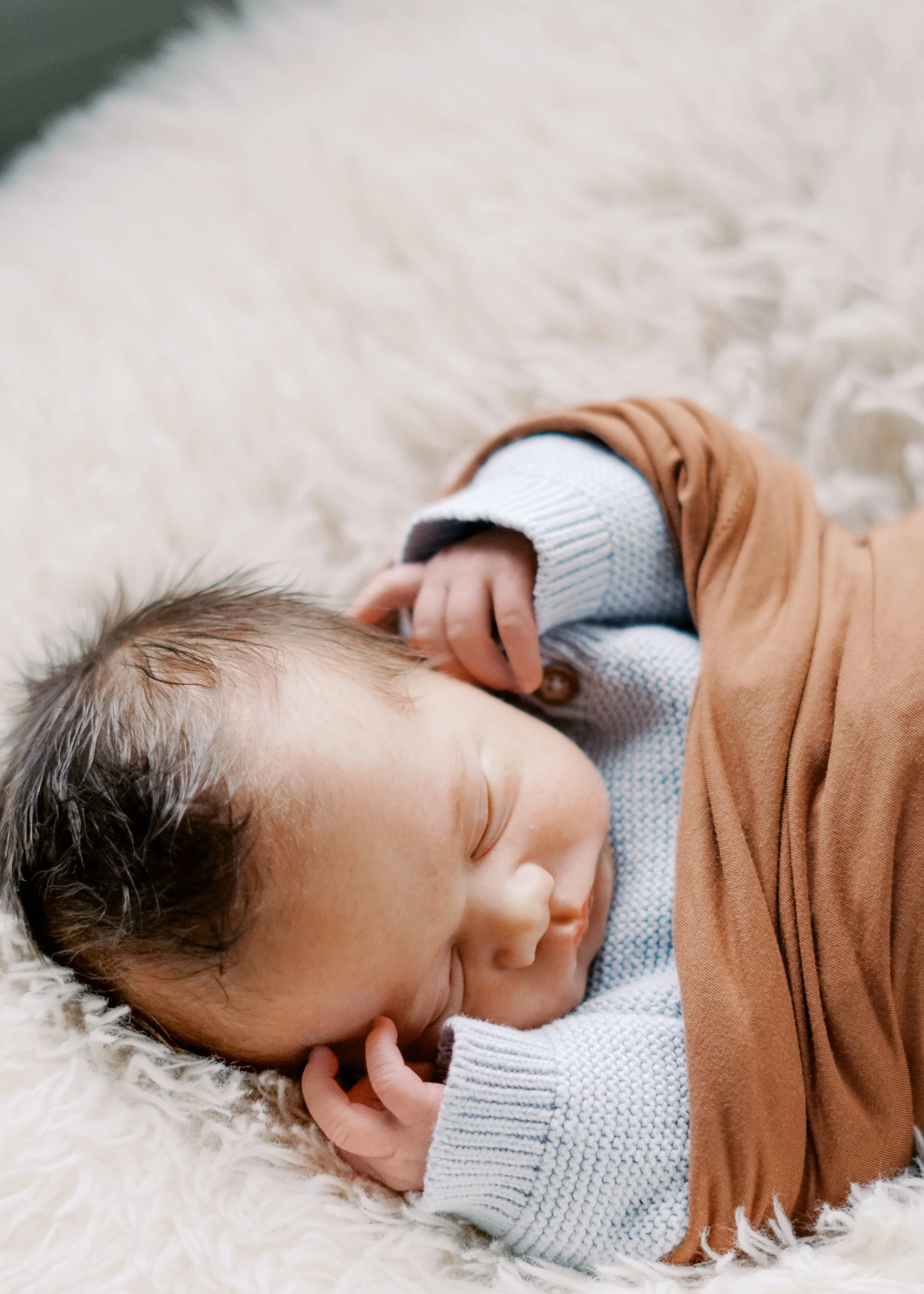Laurie’s customers, Mariana and Carmen holding hands on a green lawn on their wedding day.
