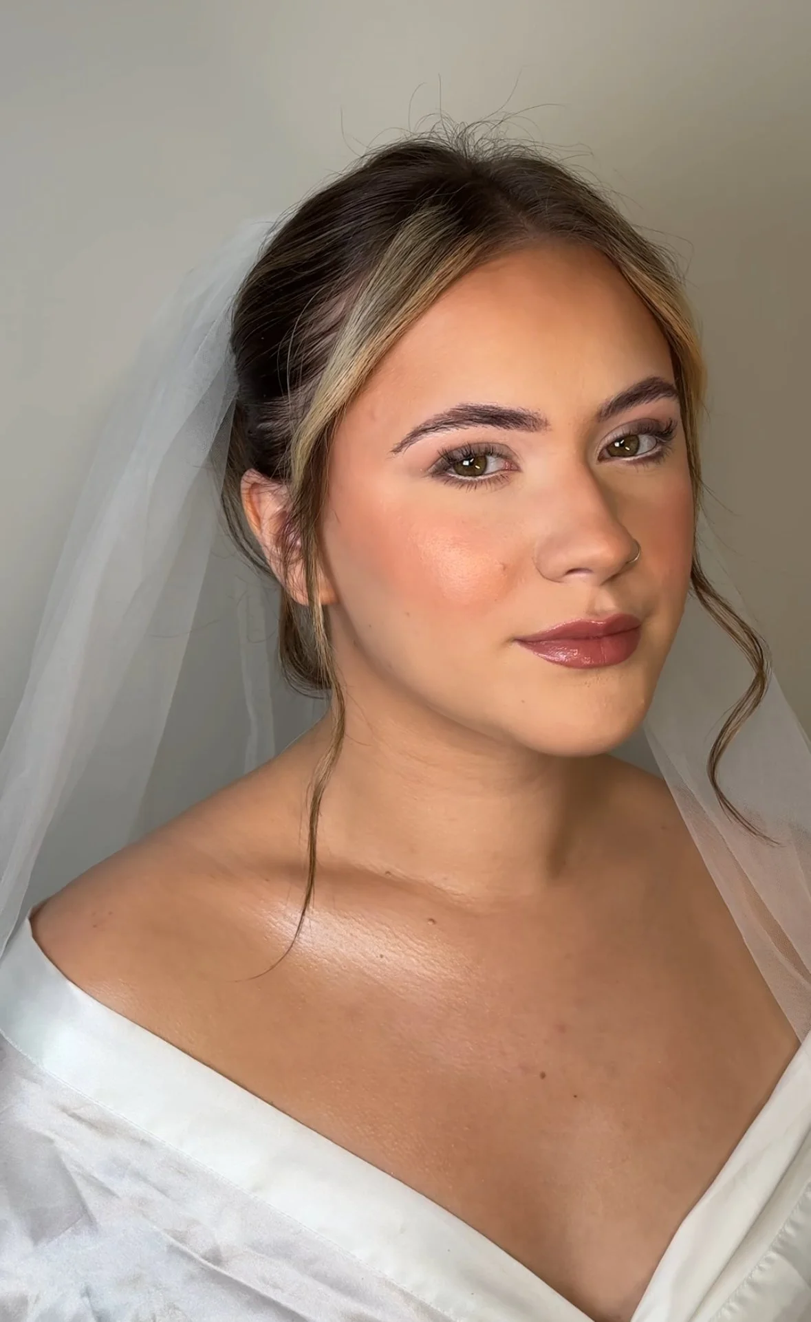 Soft and glowing bridal makeup with neutral tones for West Midlands bride
