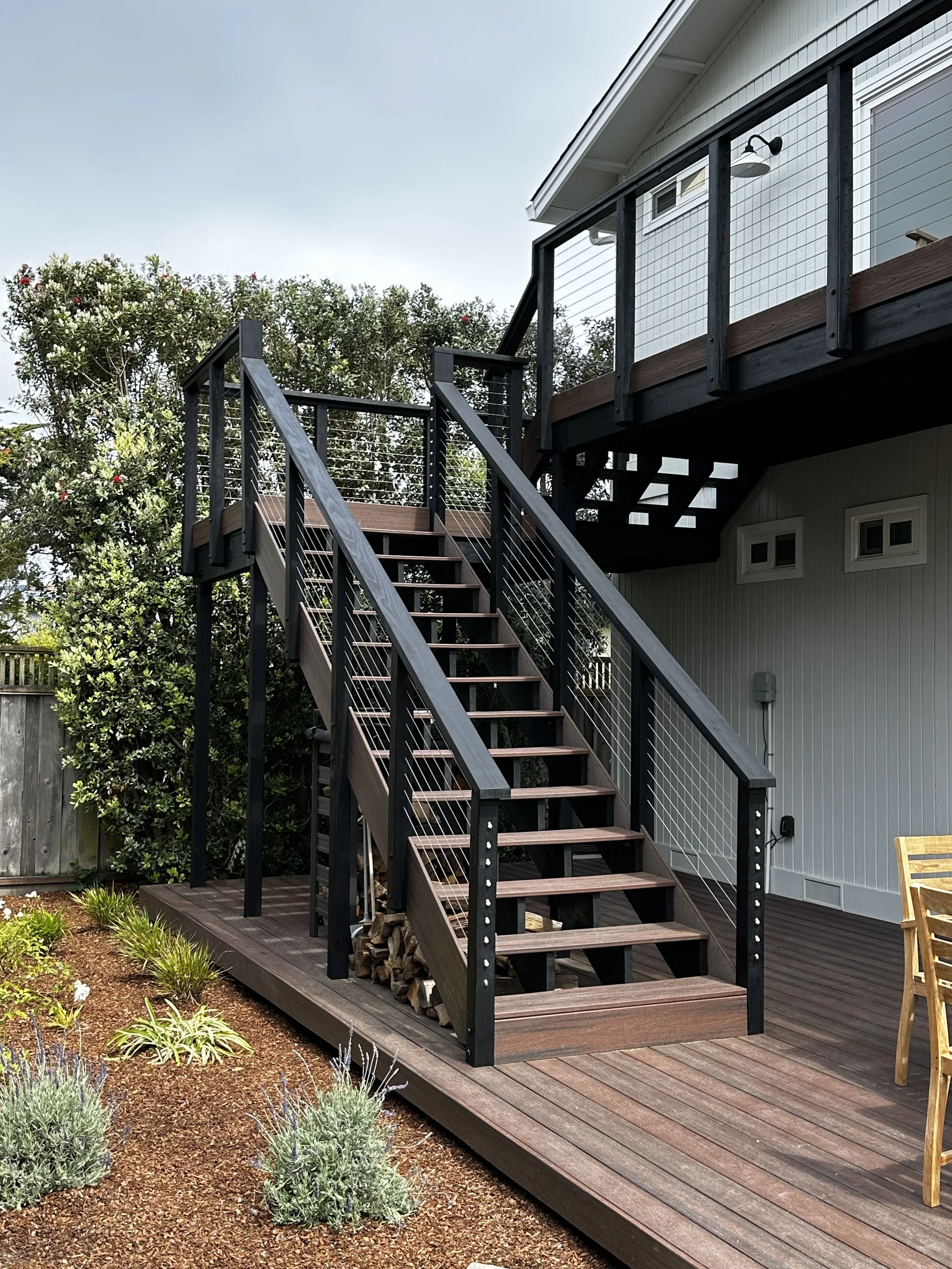 Custom exterior staircase built to last and finished with clean modern lines that create a seamless connection between levels.