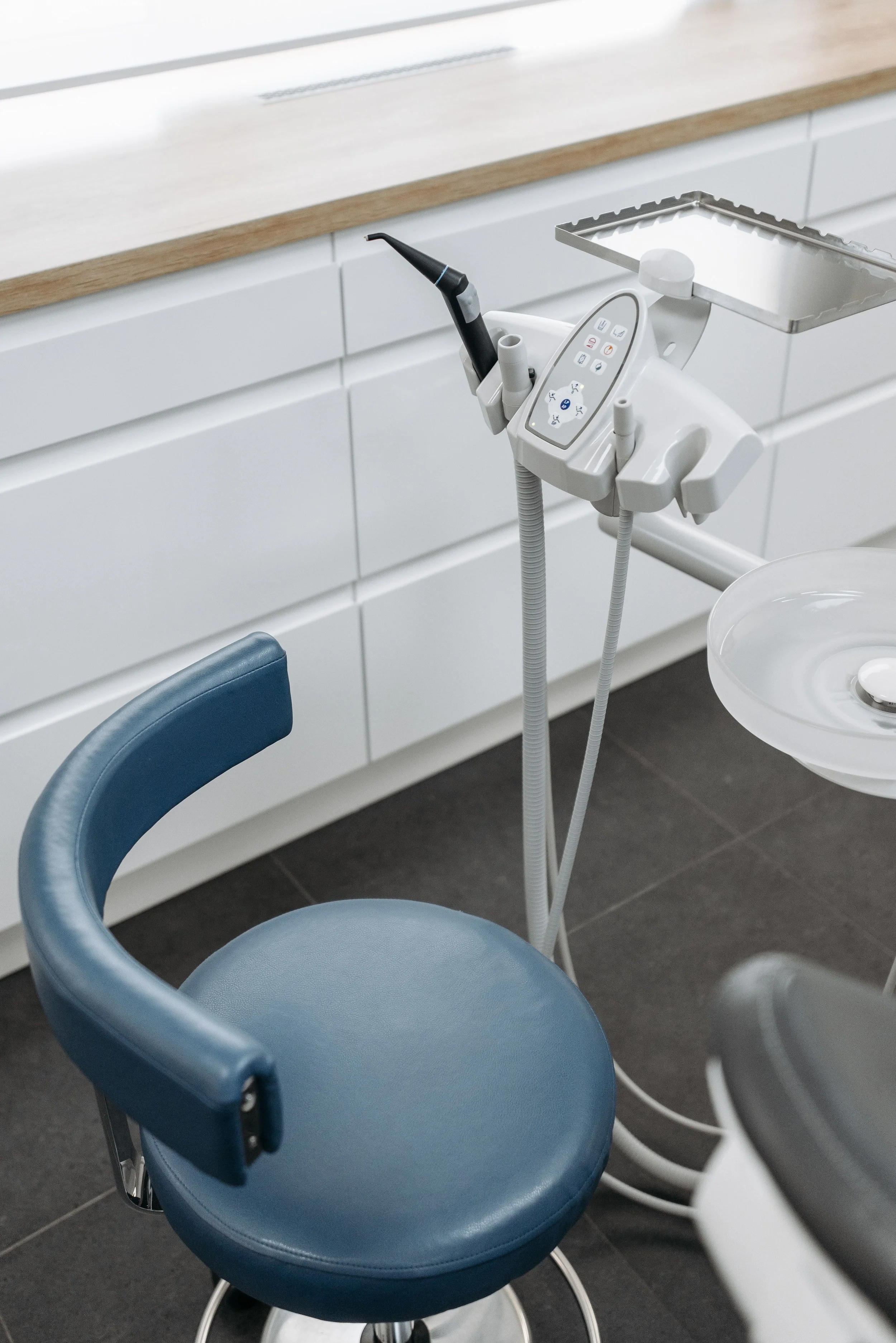 Clean healthcare exam room with treatment table and patient care area