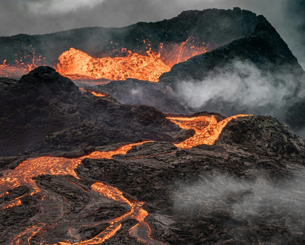 A mountain covered in lava and steam.