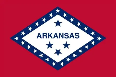 Arkansas state flag with red background, blue diamond, white border with stars, and the word 'ARKANSAS' in the center.