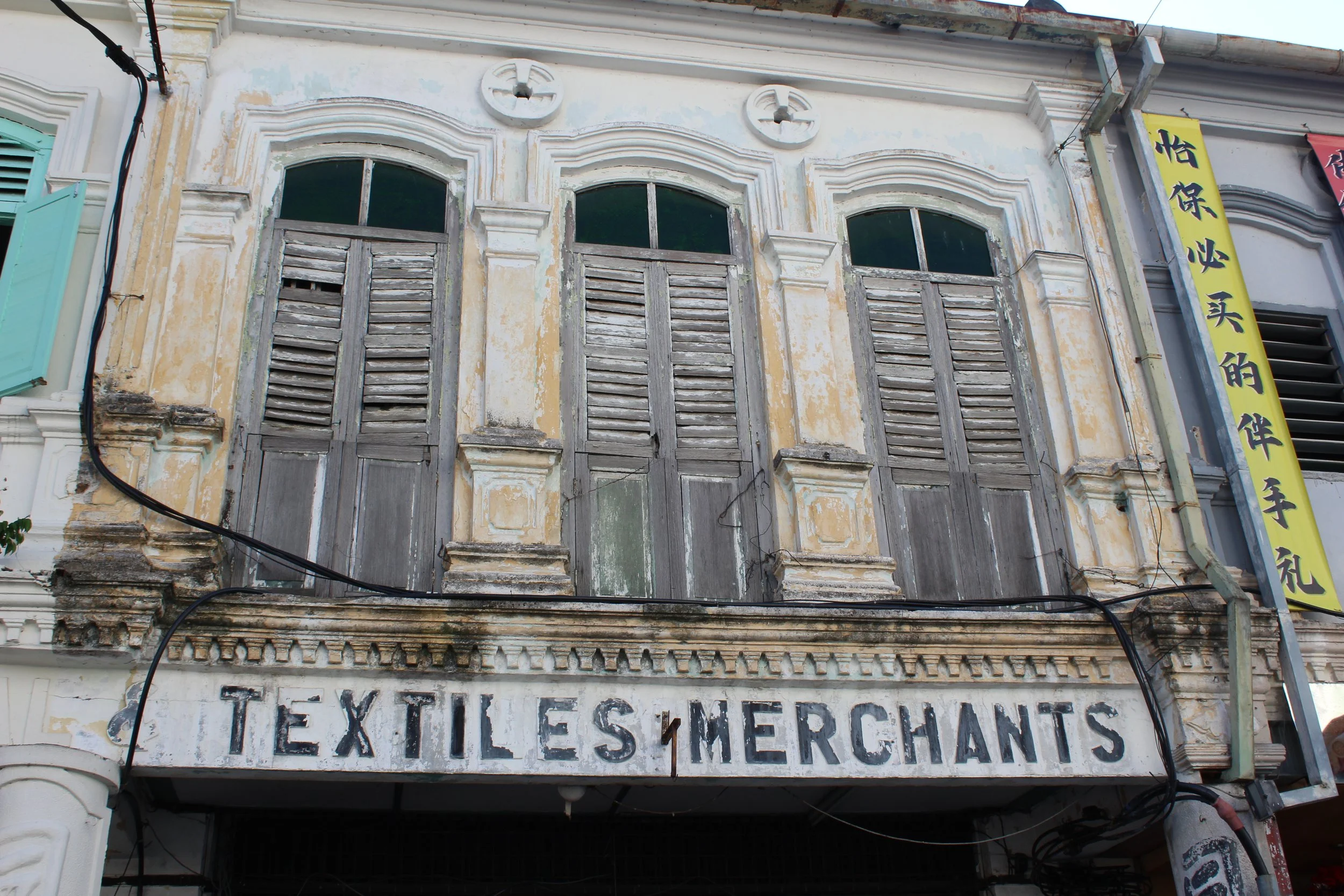 Old, weathered building facade in Ipoh's Old Town. A testament to the Chinese community and there shophouses.