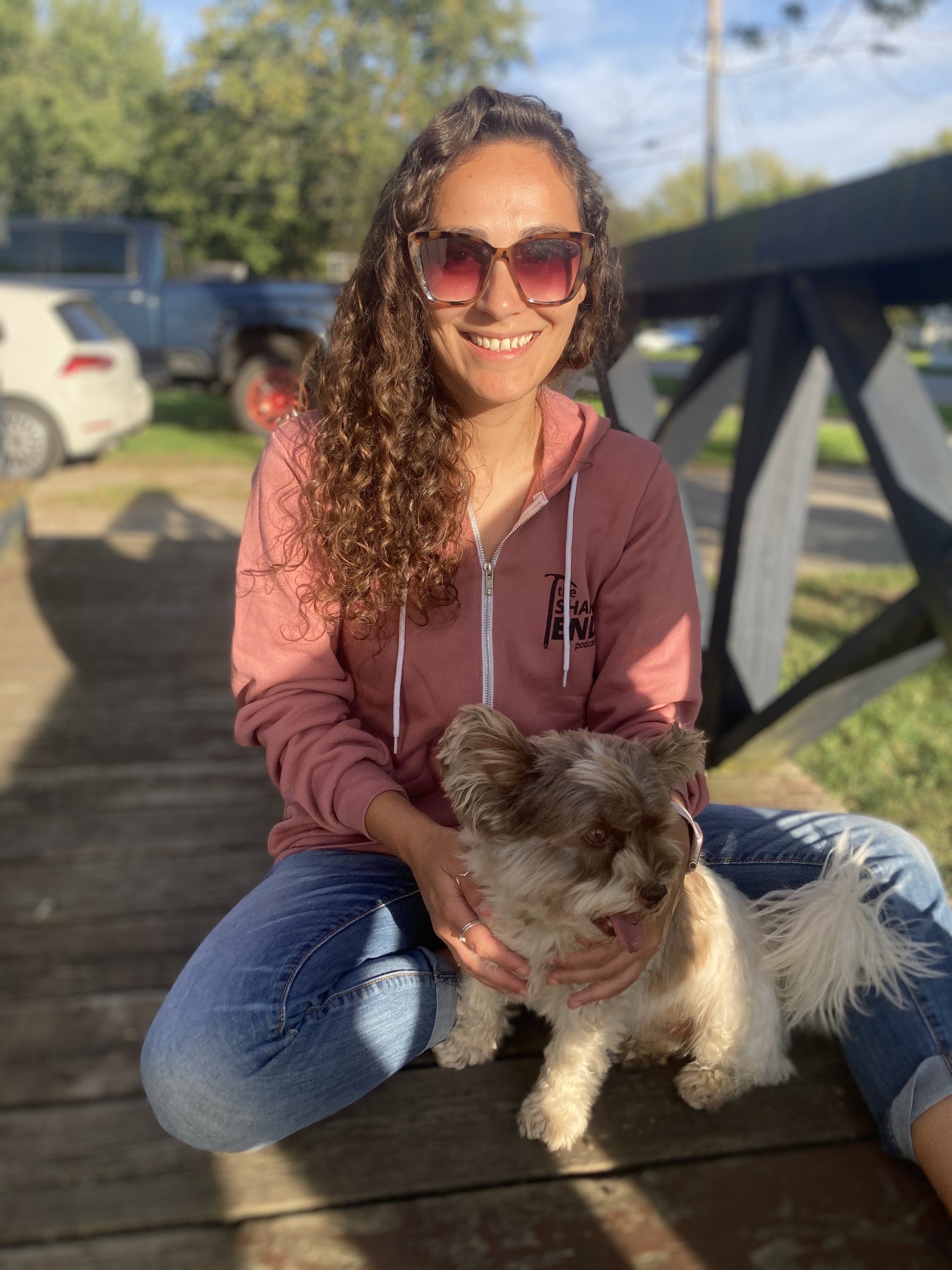 Kate sitting with Emmett on a porch