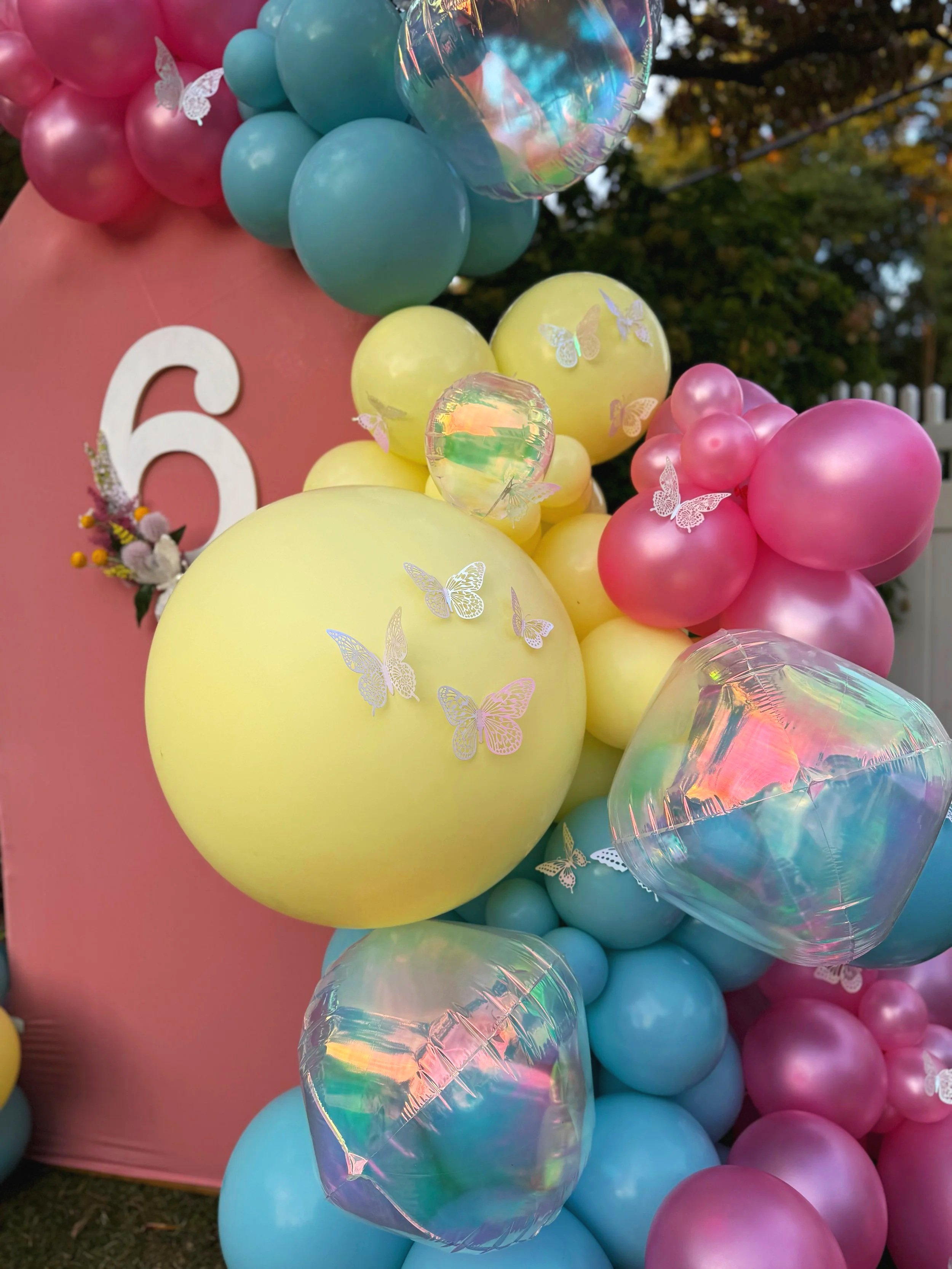 Butterfly birthday balloon arch
