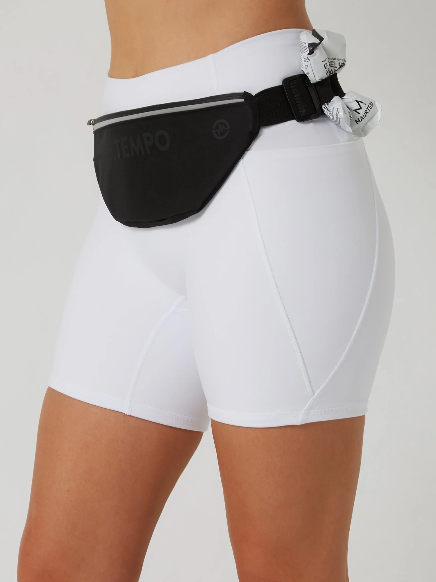 Runner wearing the CARRY / CORE black storage running belt carrying phone and keys during a training run.