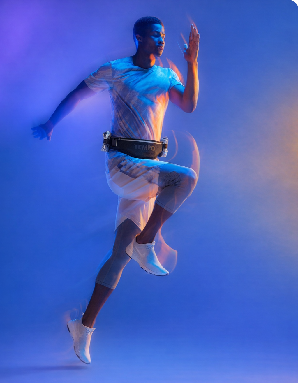 Runner wearing the Tempo PACE running belt during speed training.