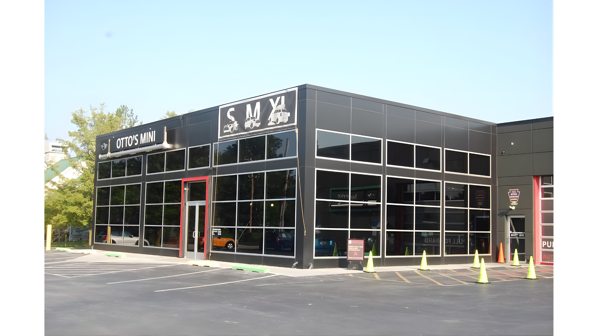 Structural engineering for a Mini Cooper dealership, including steel framing, large-span glass storefront, and commercial automotive facility design.