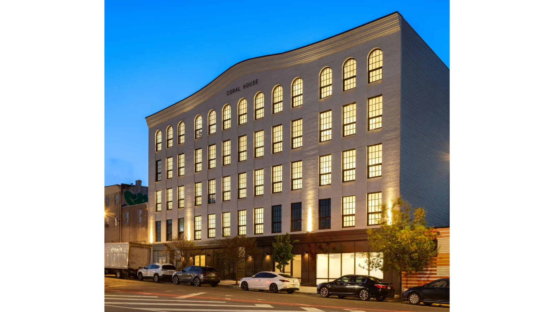 Structural engineering for the Coral House residential development, a multi-story apartment building with exterior lighting and urban streetscape design in Philadelphia, PA.