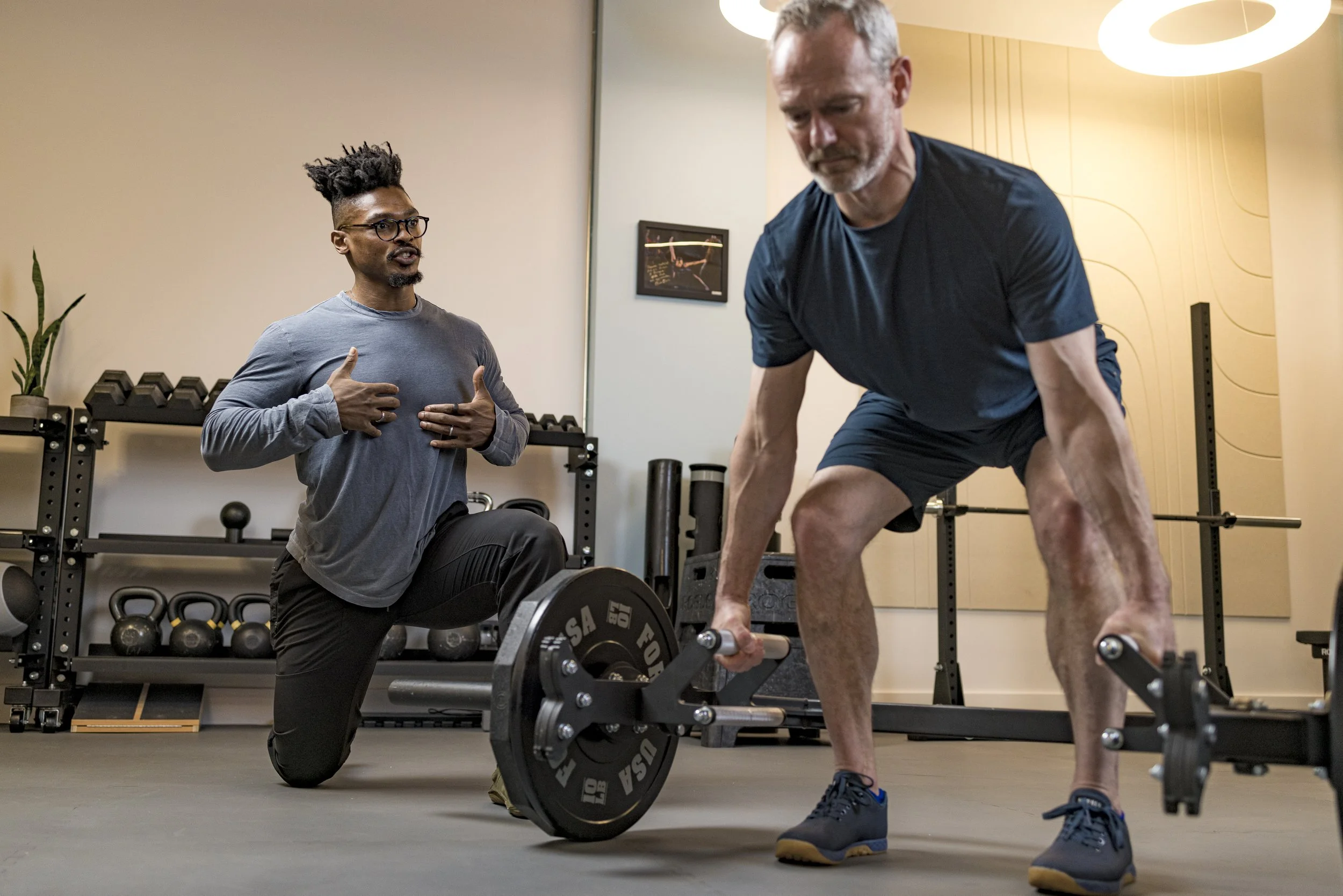 Personal trainer coaching strength and condition client at FlySpace Physical Therapy in New York.