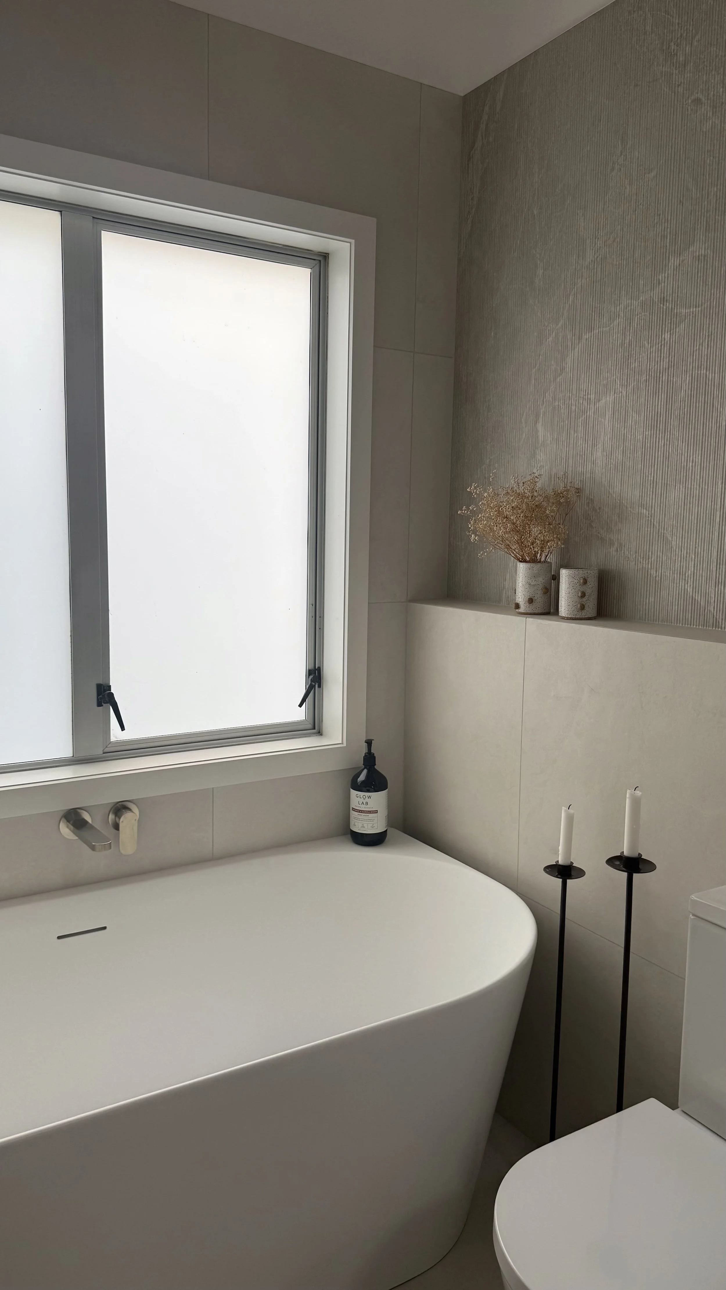 A bathroom sanctuary for a family home in Whangaparāoa built by Greyson Builders