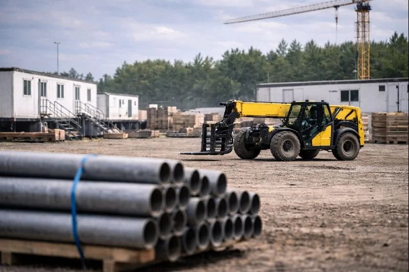 Material handling support at an active construction jobsite using forklifts and organized staging areas