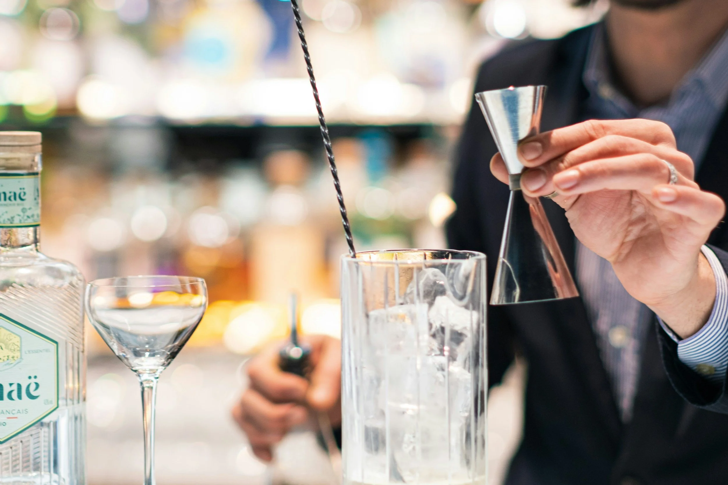 Professional bartender preparing a handcrafted cocktail for a private Atlanta event.