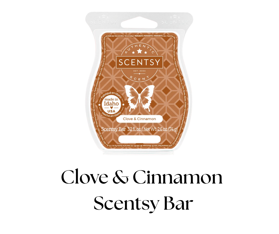 A Scentsy scent bar package in the scent Clove & Cinnamon, with a butterfly logo and text indicating it is made in Idaho, USA, with a net weight of 2.6 ounces.