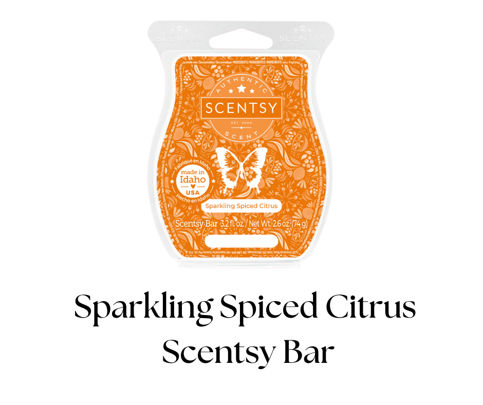 Scentsy brand scented wax bar in orange packaging with a butterfly illustration, labeled as Sparkling Spiced Citrus, made in Idaho, USA, with net weight of 2.6 ounces.