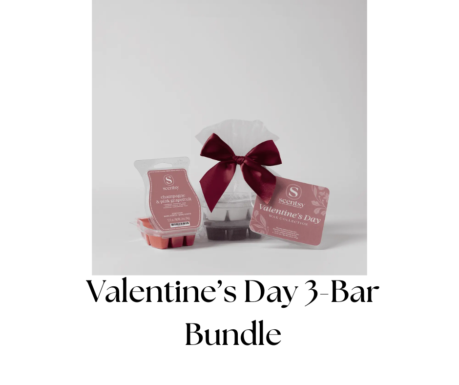Valentine's Day scented wax collection with a gift wrapped in white tissue paper and tied with a dark red ribbon, along with a pink fragrance sample labeled 'champagne & pink grapefruit.'