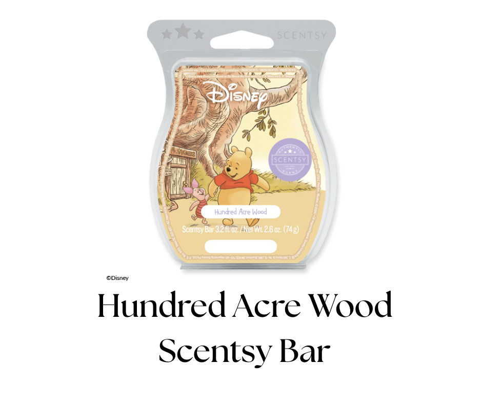 A Disney-themed scented wax melt package featuring Winnie the Pooh and Piglet standing under a tree in Hundred Acre Wood, with the scent name 'Hundred Acre Wood' and product details.