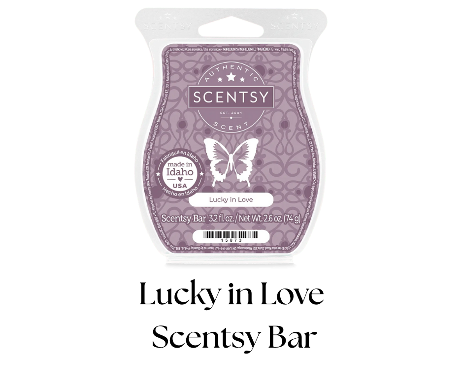 Scentsy wax melt bar in purple packaging labeled Lucky in Love, made in Idaho, net weight 3.2 fluid ounces.