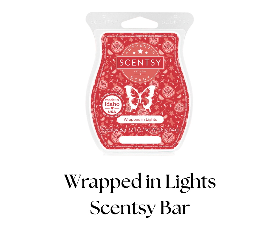 Scentsy bar in a decorative wrapper with a red background, white butterfly and berry illustrations, and the text "Wrapped in Lights," made in Idaho, USA.