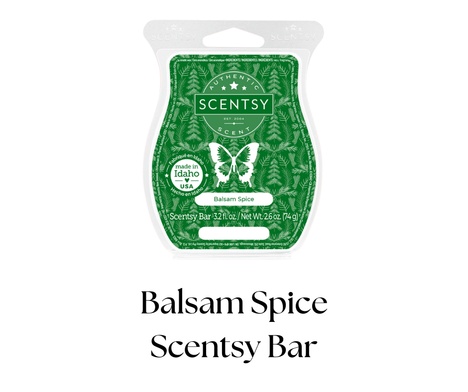 A Scentsy bar in Balsam Spice scent, green packaging with a butterfly, stars, and tree patterns, labeled as made in Idaho, USA, weighing 3.2 fluid ounces or 74 grams.