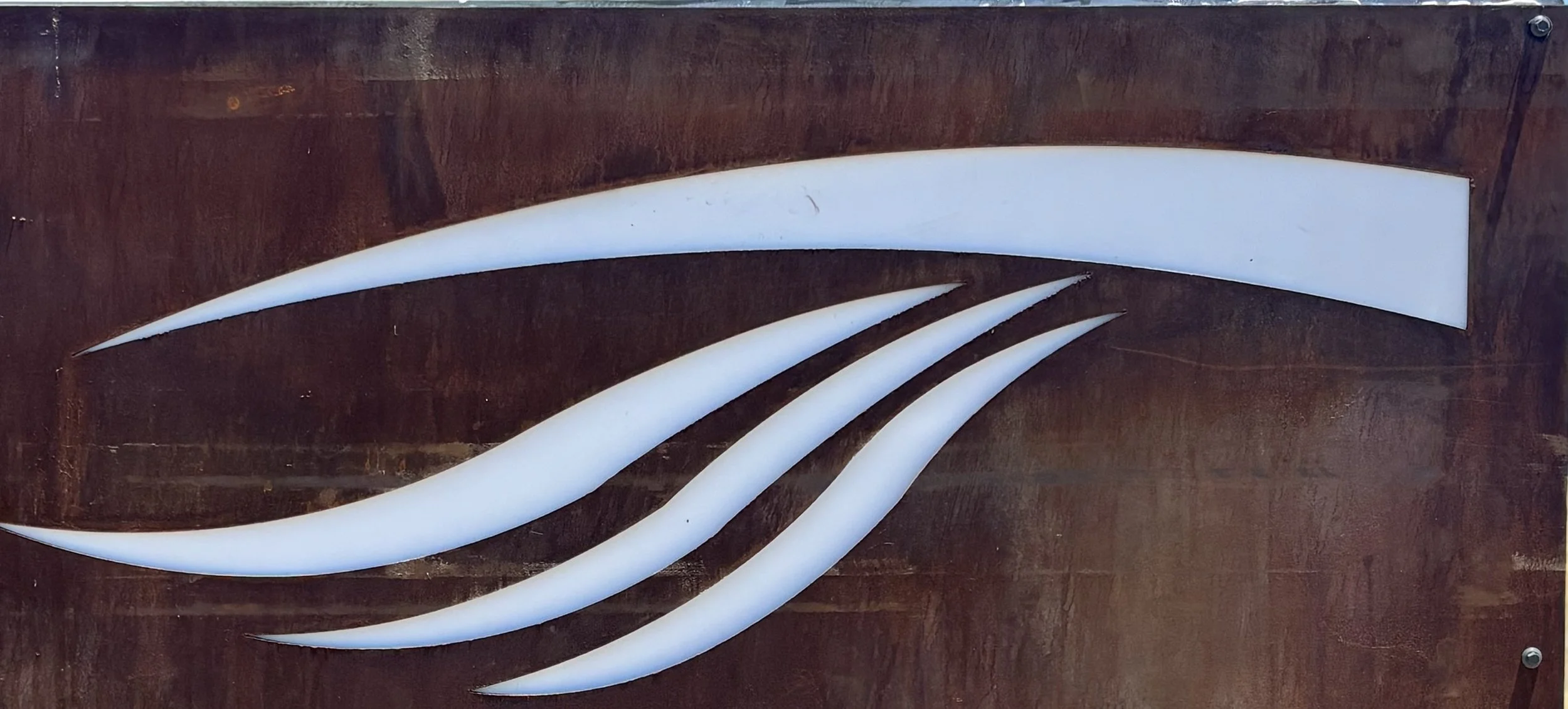 Decorative wall art featuring a stylized, abstract design with three white, curved, tapering shapes resembling claws or waves on a dark wood background.