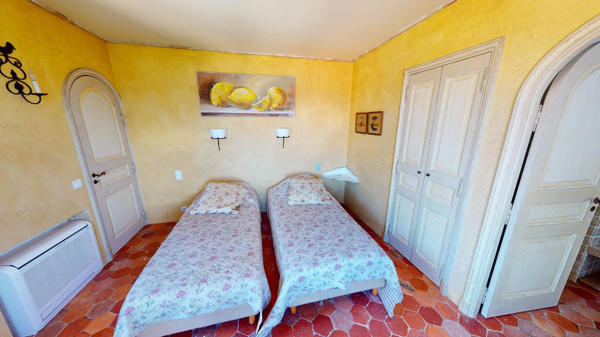 Charming twin bedroom at family villa in Les Parcs de Saint-Tropez.