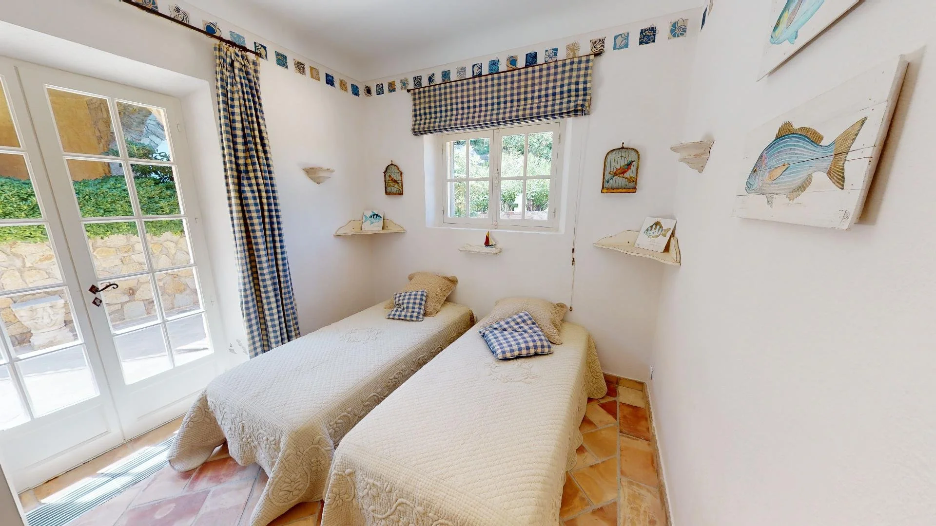 Nautical-themed twin bedroom at family villa in Les Parcs de Saint-Tropez.
