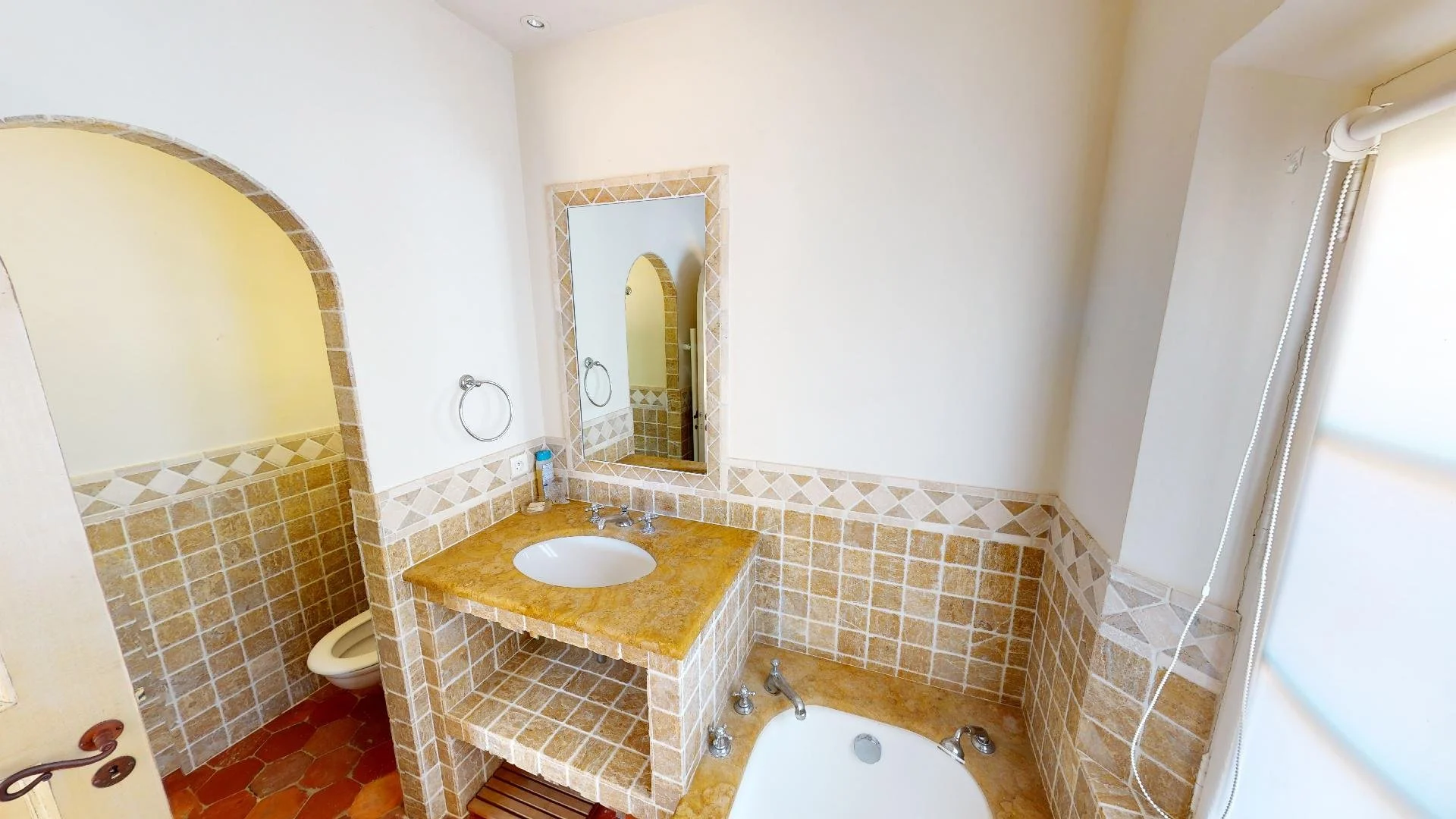 Private bathroom with bathtub at Saint-Tropez luxury villa.