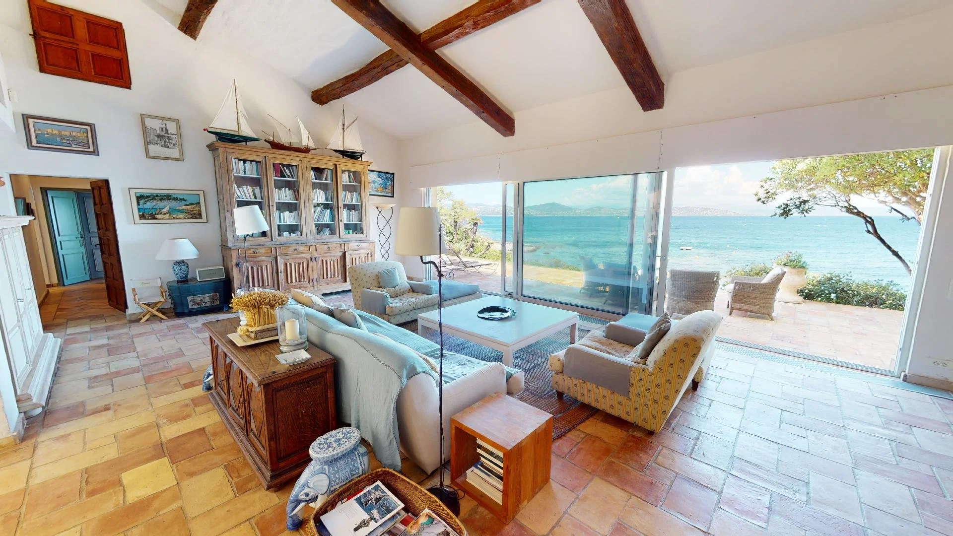 Living room with sea view at waterfront villa in Les Parcs de Saint-Tropez.