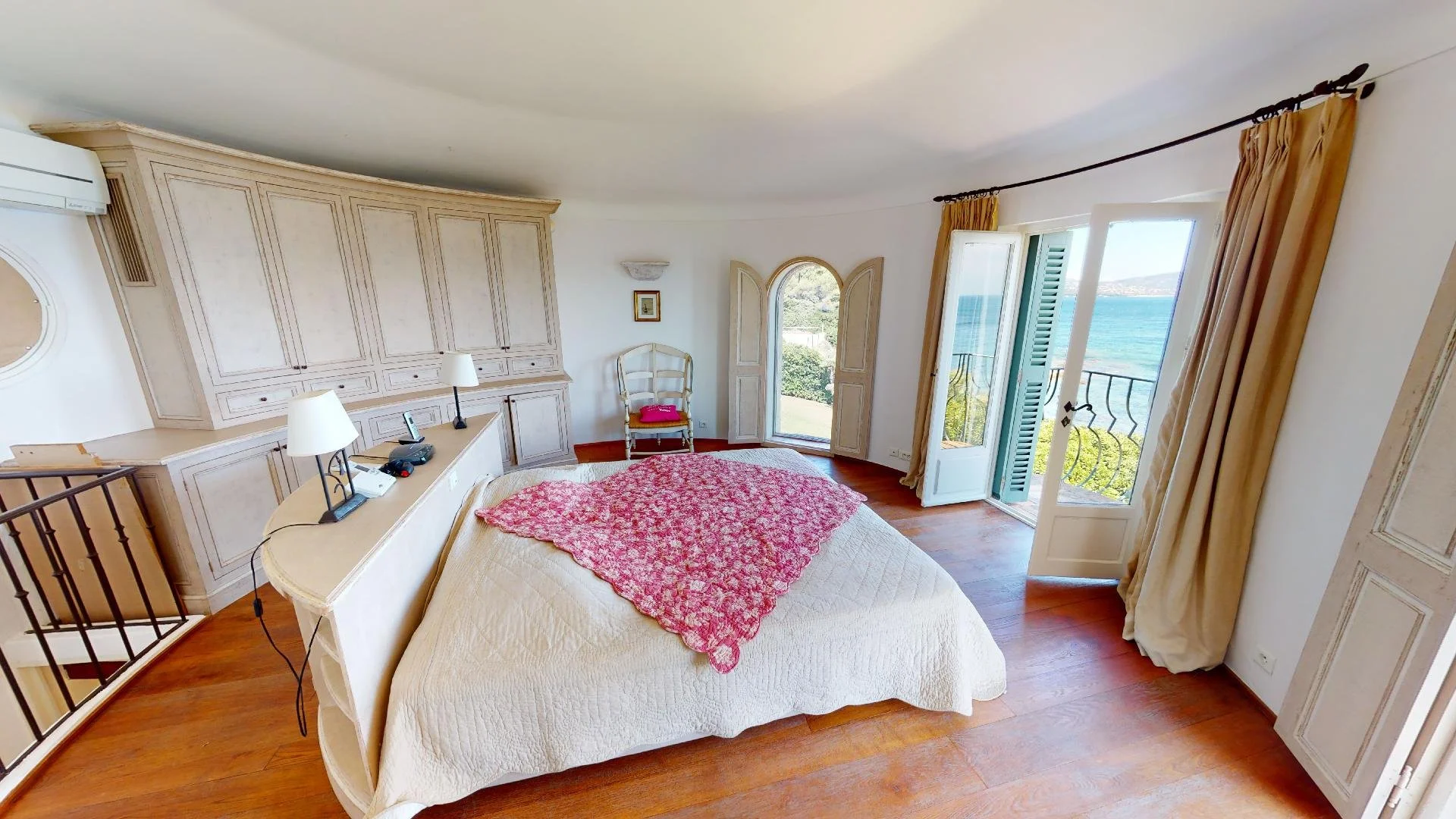 Sea view bedroom with balcony at waterfront villa in Les Parcs de Saint-Tropez.