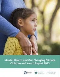 Young girl wearing a yellow sweater being comforted by an adult outdoors, with a report cover titled 'Mental Health and Our Changing Climate Children and Youth Report 2023' visible.