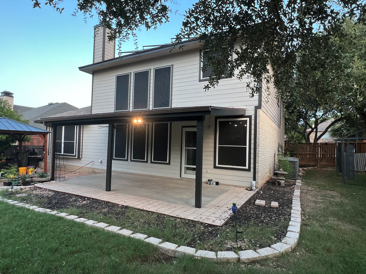 Completed exterior painting project on a two-story San Antonio home