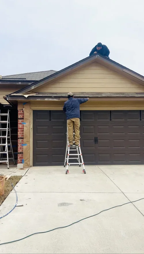 Brush Paint Pros painting a home exterior in San Antonio