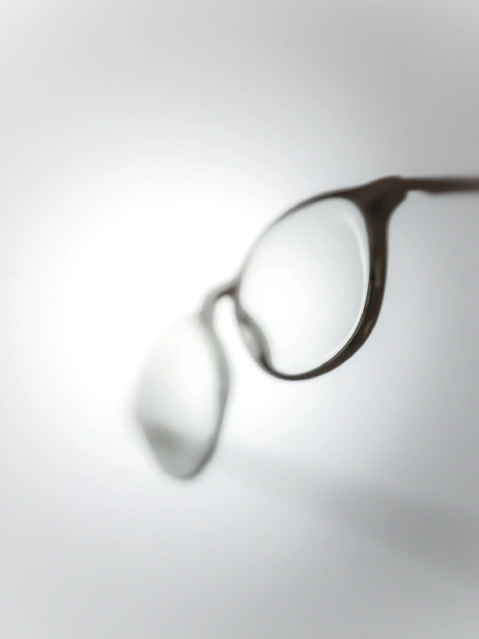 Close-up of a pair of eyeglasses with a blurred background