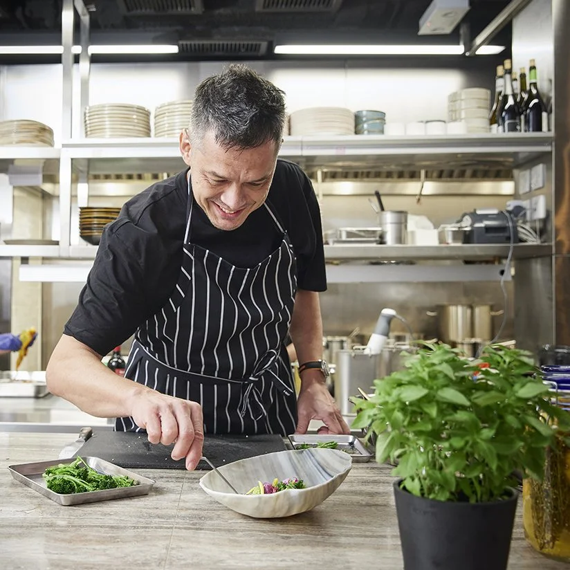 Chef putting final touches to a dish