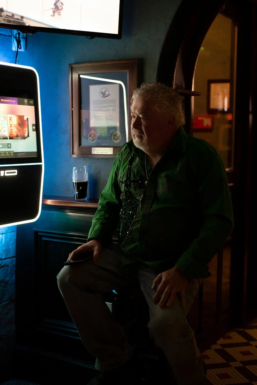 Red Bank, New Jersey, 2025. A man listening to live Irish folk music in a pub in Red Bank.