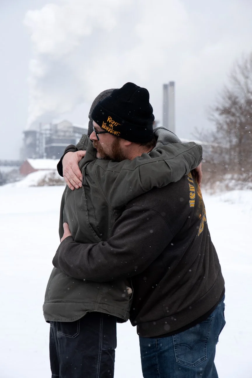 Clairton, Pennsylvania, 2025. Justin Ellsworth hugging his son, in front of the steel mill. This photo is very important in this project because it captures something Bruce Springsteen often talks about in his songs, the father-son relationship. In h