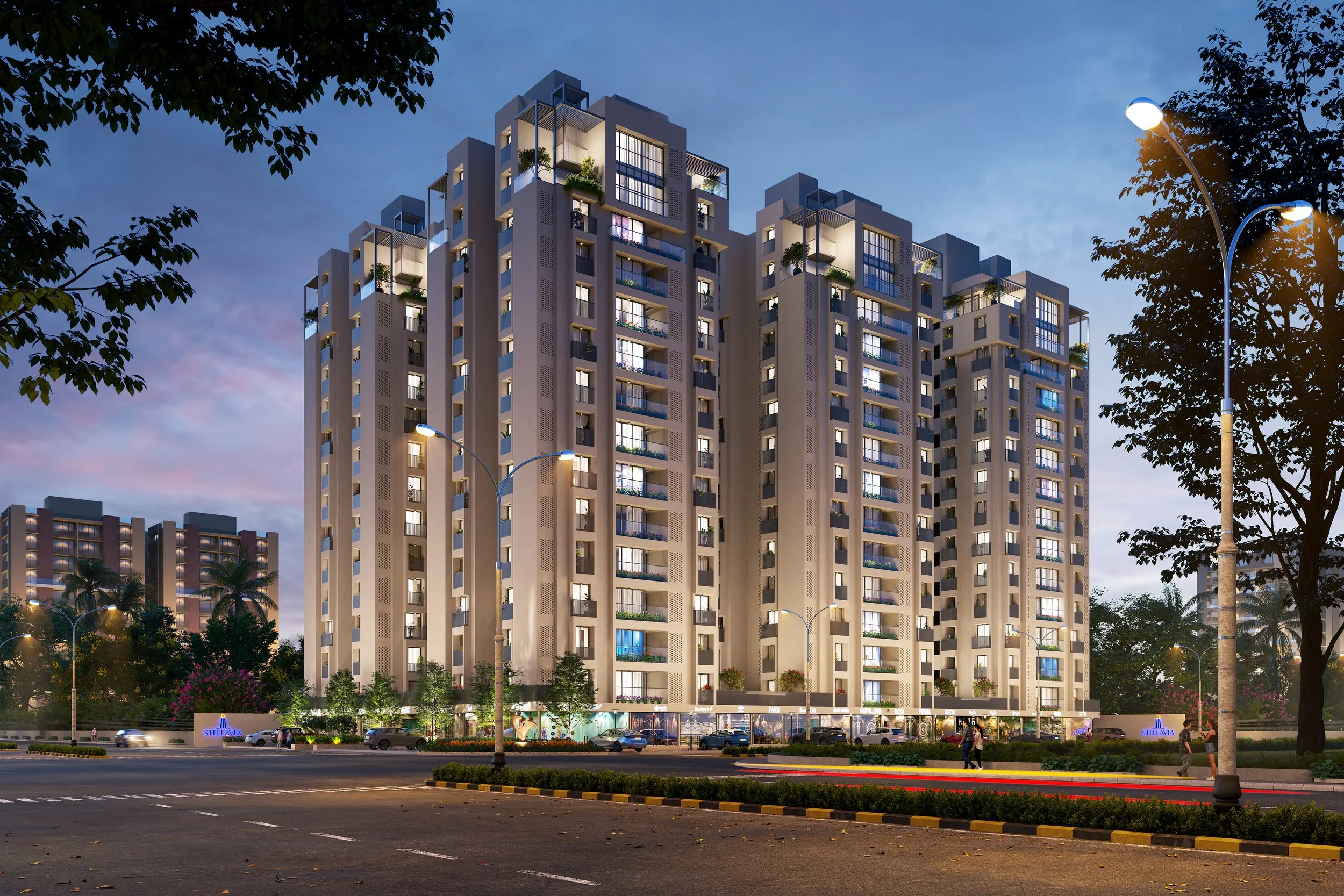 Modern high-rise apartment building illuminated at dusk, with trees, streetlights, cars, and pedestrians in the foreground.