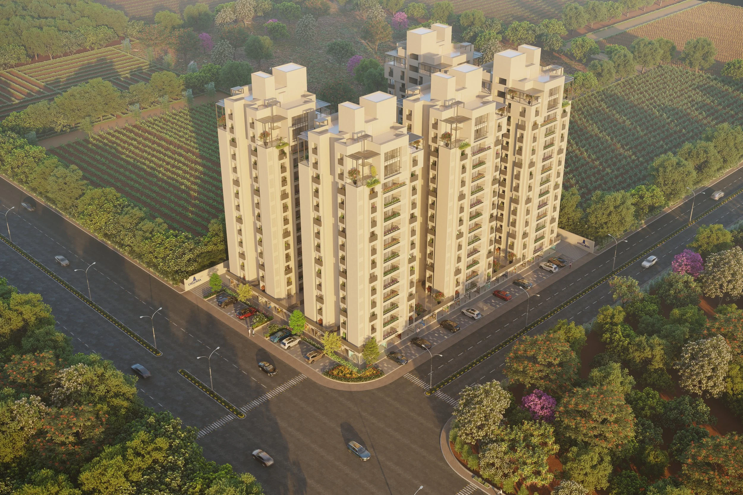 A large multi-story residential apartment complex surrounded by trees, parking lots, and green fields.