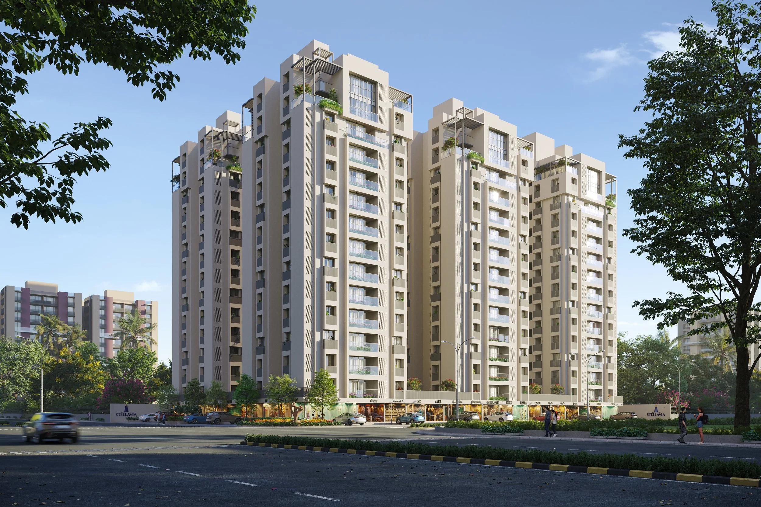 Modern high-rise apartment building with multiple balconies, surrounded by trees and a street with cars and pedestrians.